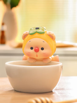 OYO Fruit Party HIPPER Blind Box Series toy animal in a bowl, part of a collectible art toy series with secret designs.