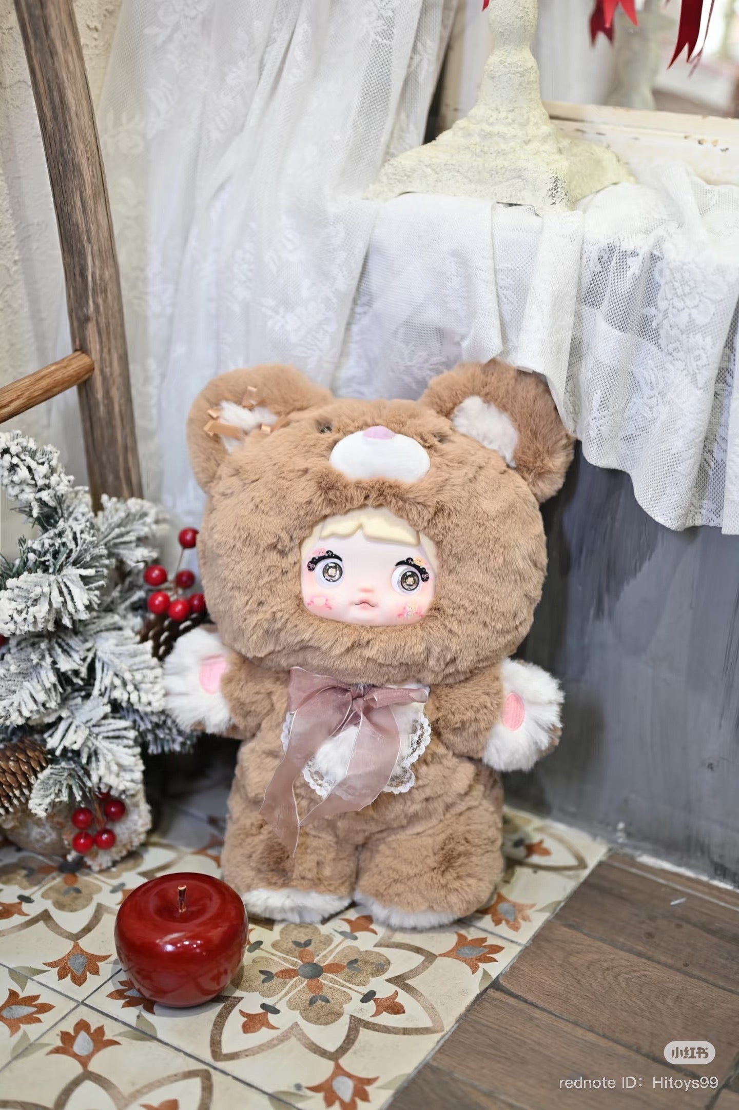 Nommi - 400% Goodnight Bear Plush Series Blind Box showing a stuffed bear doll in a garment, part of a collectible art toy series.