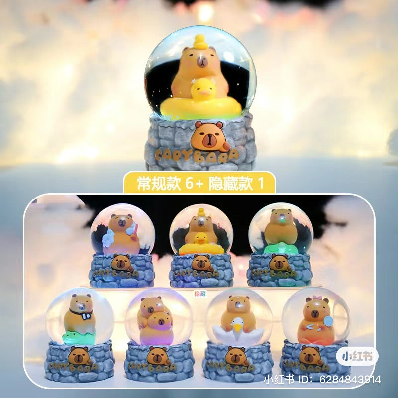 Capybara Snow Globe Blind Box Series featuring various toy bears inside snow globes; includes 6 regular designs and 5 secret options.