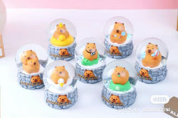 Capybara Snow Globe Blind Box Series featuring small figurines of bears inside snow globes. Includes 6 regular designs and 5 secret designs.