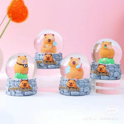 Capybara Snow Globe Blind Box Series: small toy bears encased in snow globes, part of a collectible series with regular and secret designs.