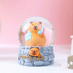 Capybara Snow Globe Blind Box Series: A snow globe featuring a bear inside, part of a collection with 6 regular and 5 secret designs.