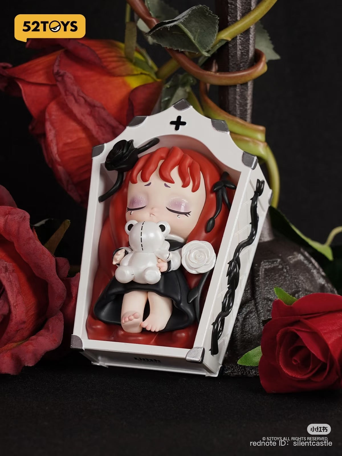 Lilith The Century Of Marry Blind Box Series toy doll in a coffin with teddy bear and roses, available for preorder, ships April 2025.