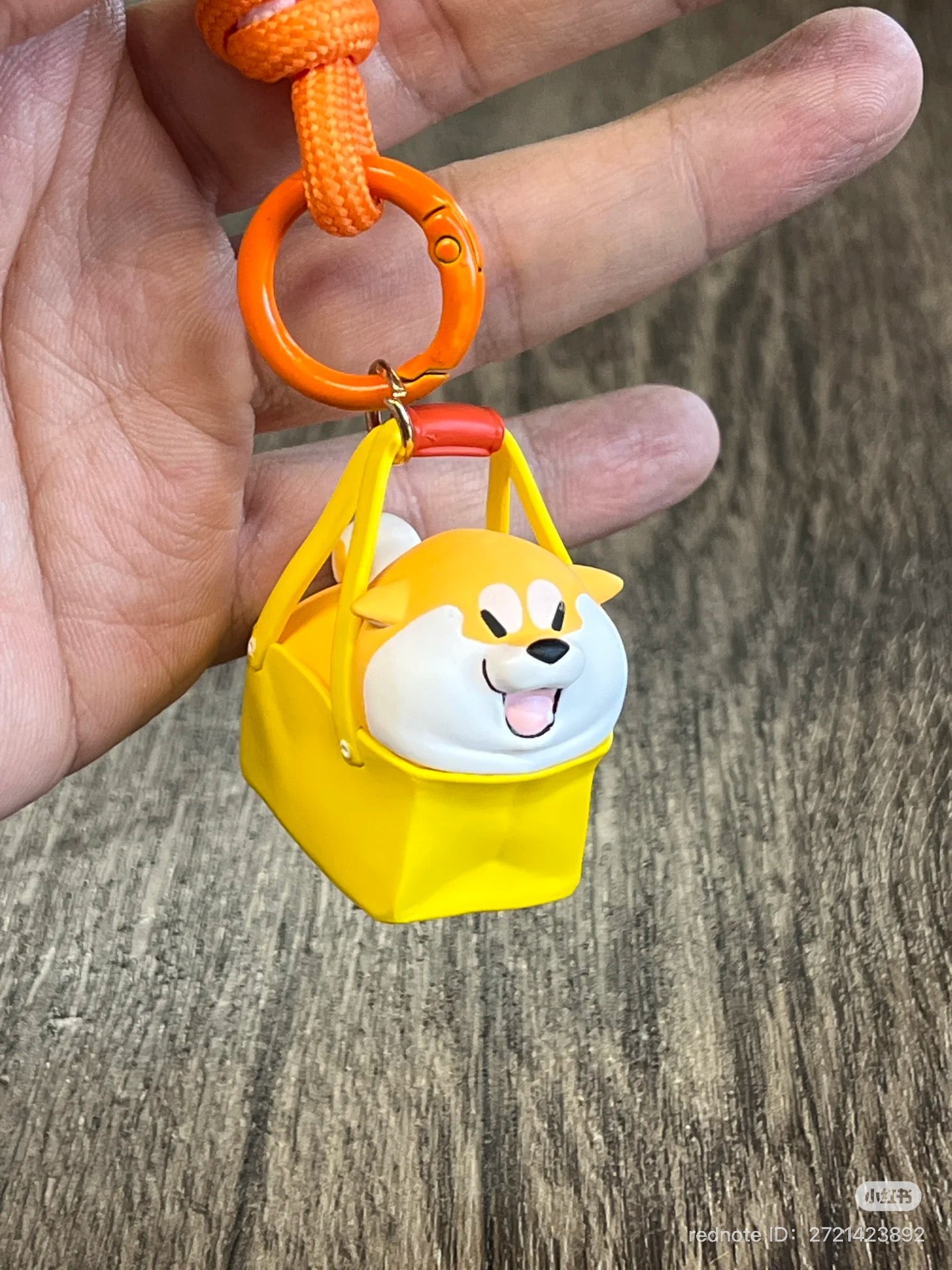 Shiba Inu GouQi keychain from Puppy Crossing Blind Box Series, featuring a dog in a yellow bag. Preorder for late April 2025 release.