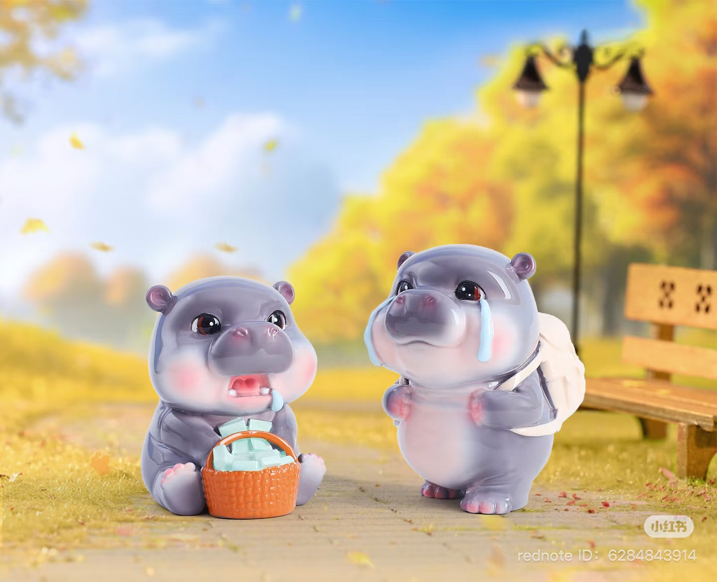 MooDeng Blind Box Series features hippo figurines, including one with tears and another holding a basket, on a park path.