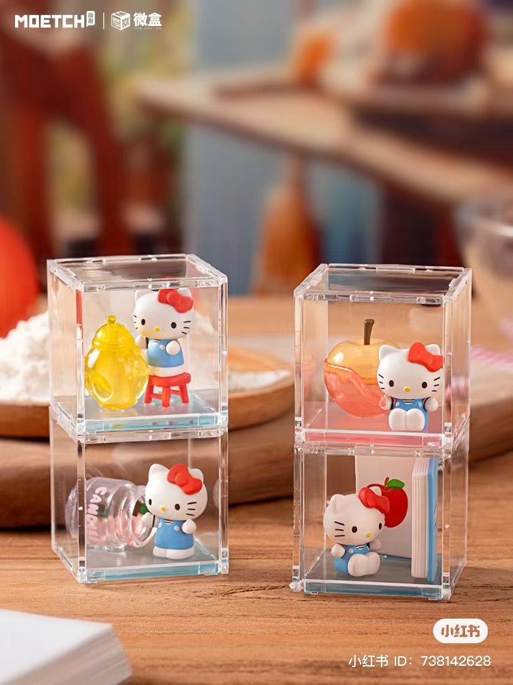 Alt text: Hello Kitty Big Apple Workshop Series figurines in a clear box, featuring 8 regular designs and 1 secret.