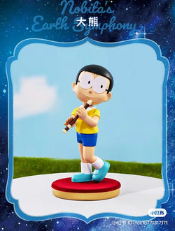 A cartoon figurine of Nobita playing a flute from Doraemon the Movie: Nobita's Earth Symphony Blind Box Series.