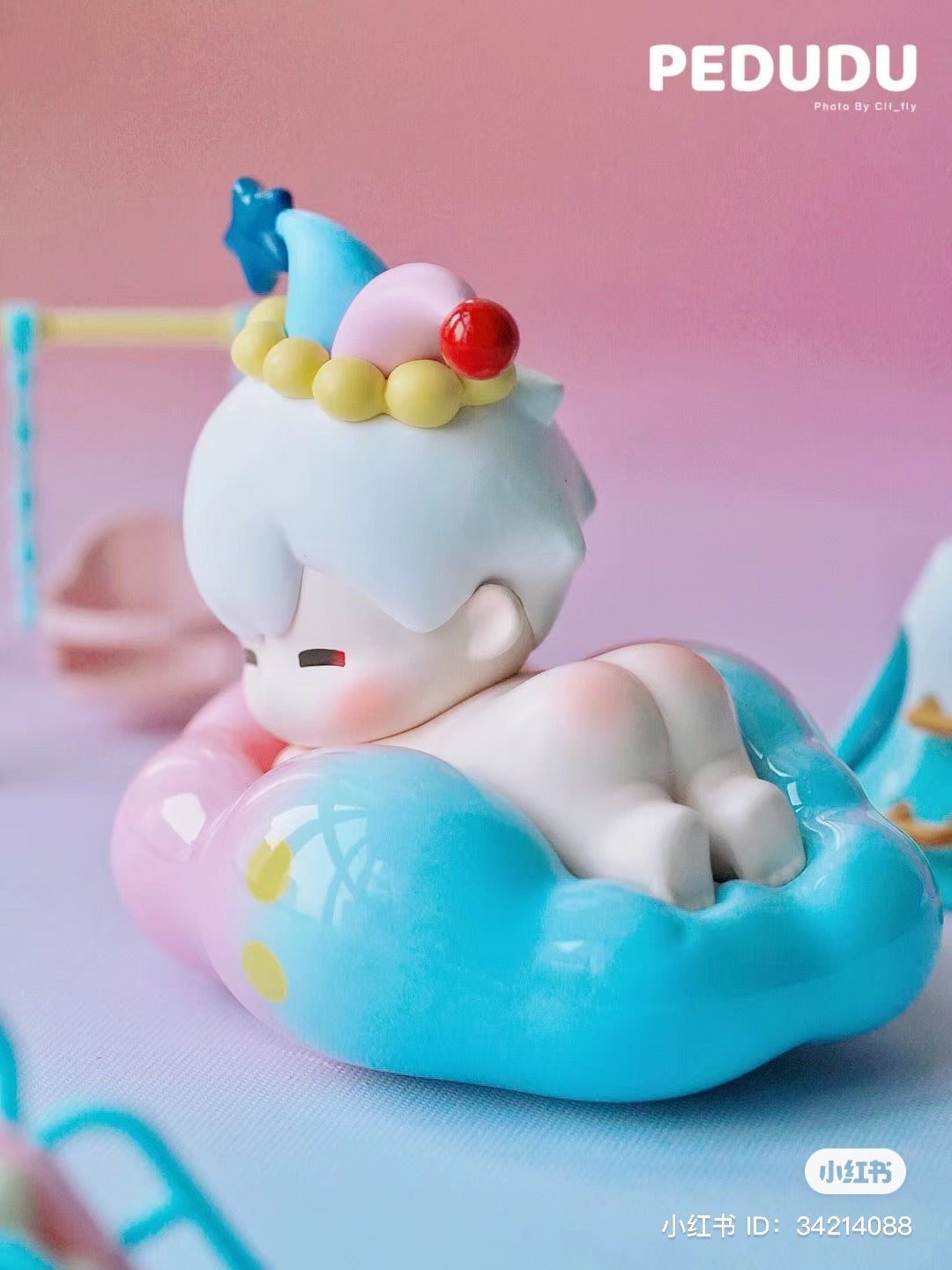 Alt text: PEDUDU Lies on Cloud Blind Box Series toy figurine of a baby for preorder, includes 12 regular designs, 2 special, and 1 secret.