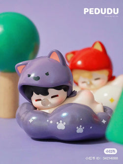 Alt text: PEDUDU Lies on Cloud Blind Box Series toy figurines displayed on a table, available for preorder, shipping August 2024.