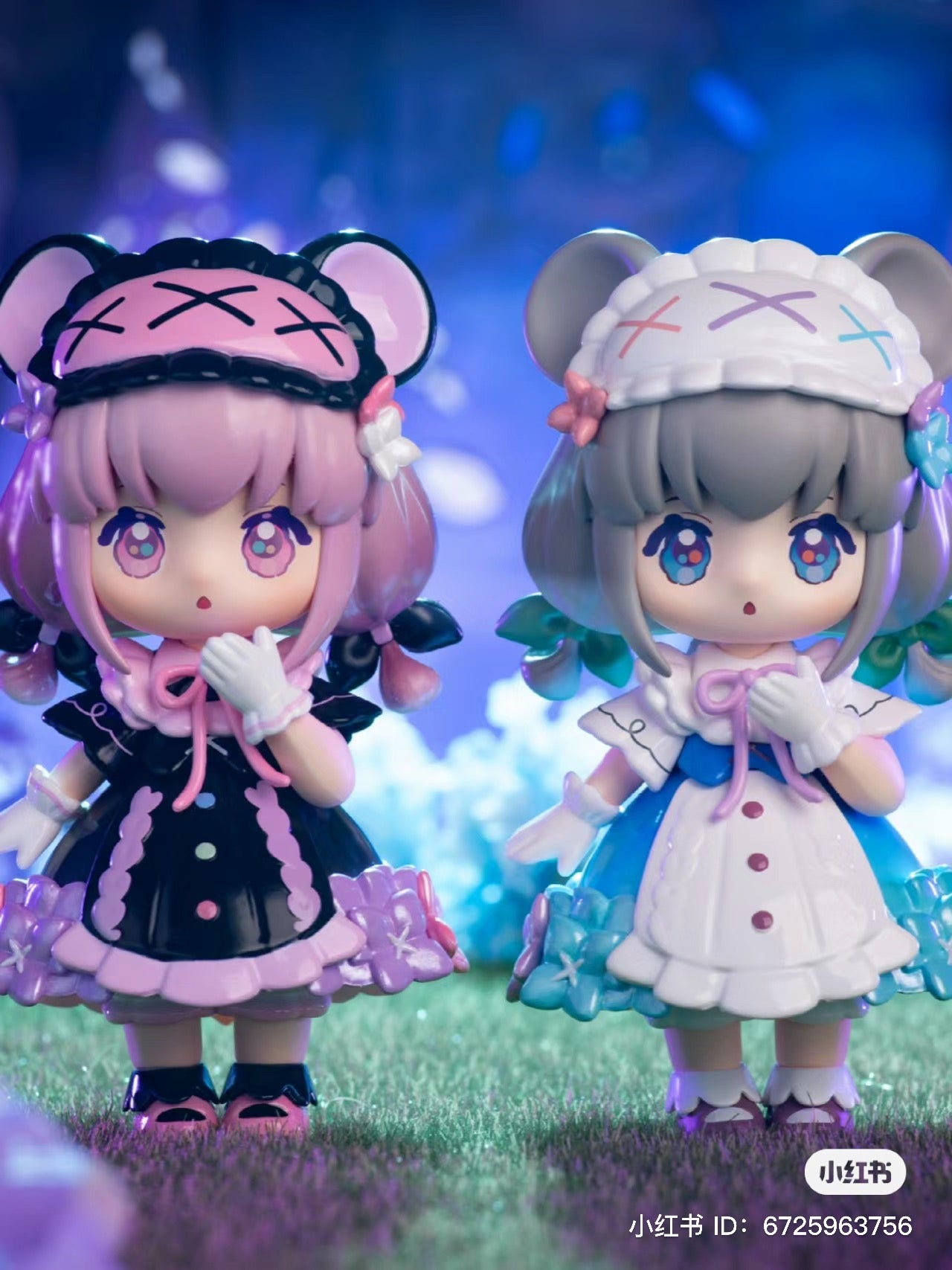 Alt text: Two NINIZEE The Secret Realm of Flowers toy figurines on grass from the blind box series, available for preorder, shipping August 2024.