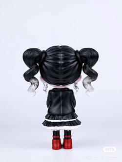 Alt text: Kiki Girls 4.0 statue, 11cm resin/PVC, featuring a girl with pigtails and red boots, back view.