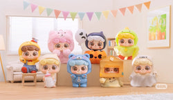 Be Your Q Baby Blind Box Series toys displayed on a shelf, featuring various figurines, including a toy ghost and a doll holding a bottle.