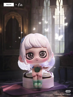 Cartoon figurine of a girl sitting on a cake from KIKI- To the Guardian Star Blind Box Series, featuring 10 regular designs and 1 secret.