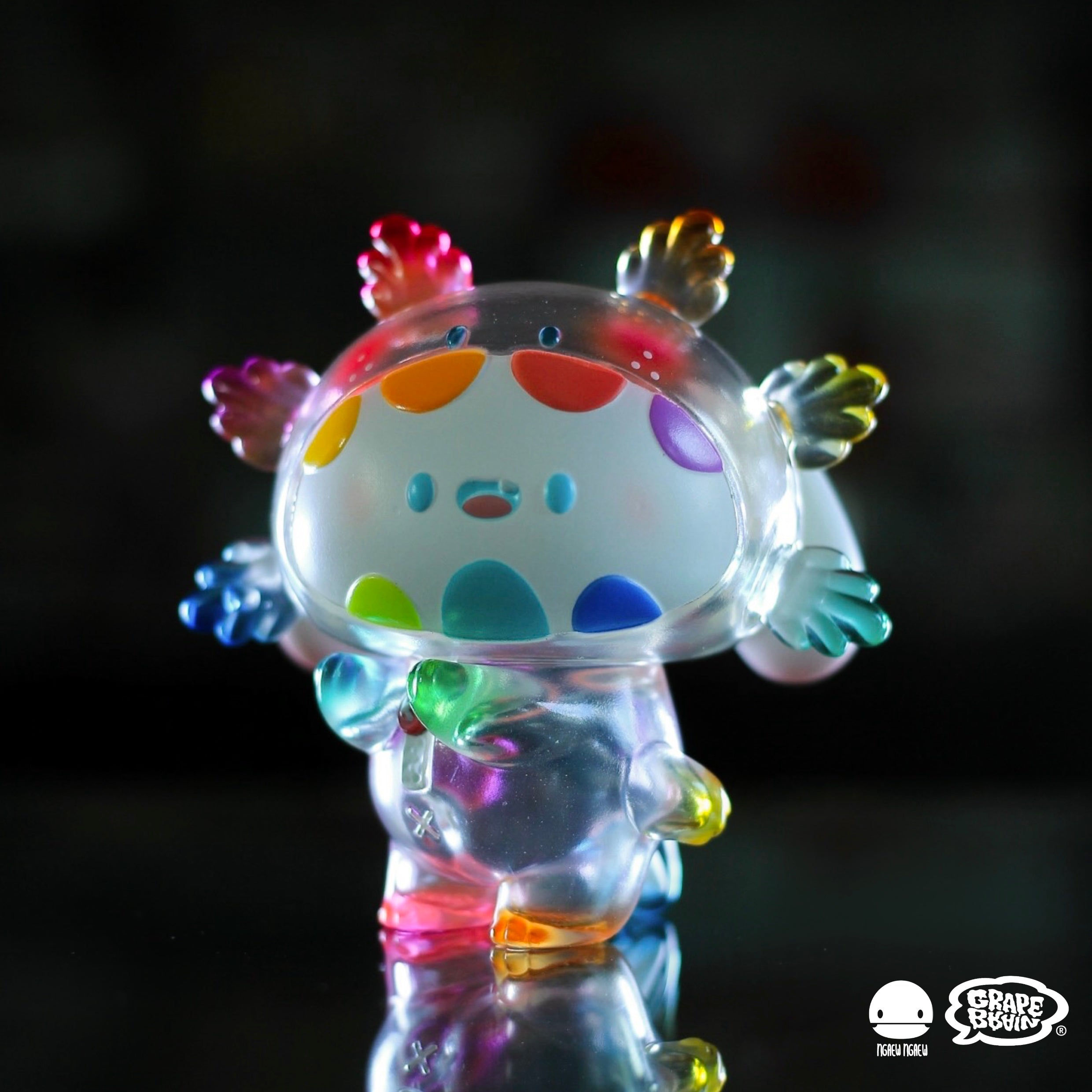 Ngacaroni Clear Rainbow by Ngaew x Grape Brain, a preorder soft vinyl toy, limited to 150 pieces, featuring colorful spots. Size: 8 cm. Ships April 2025.