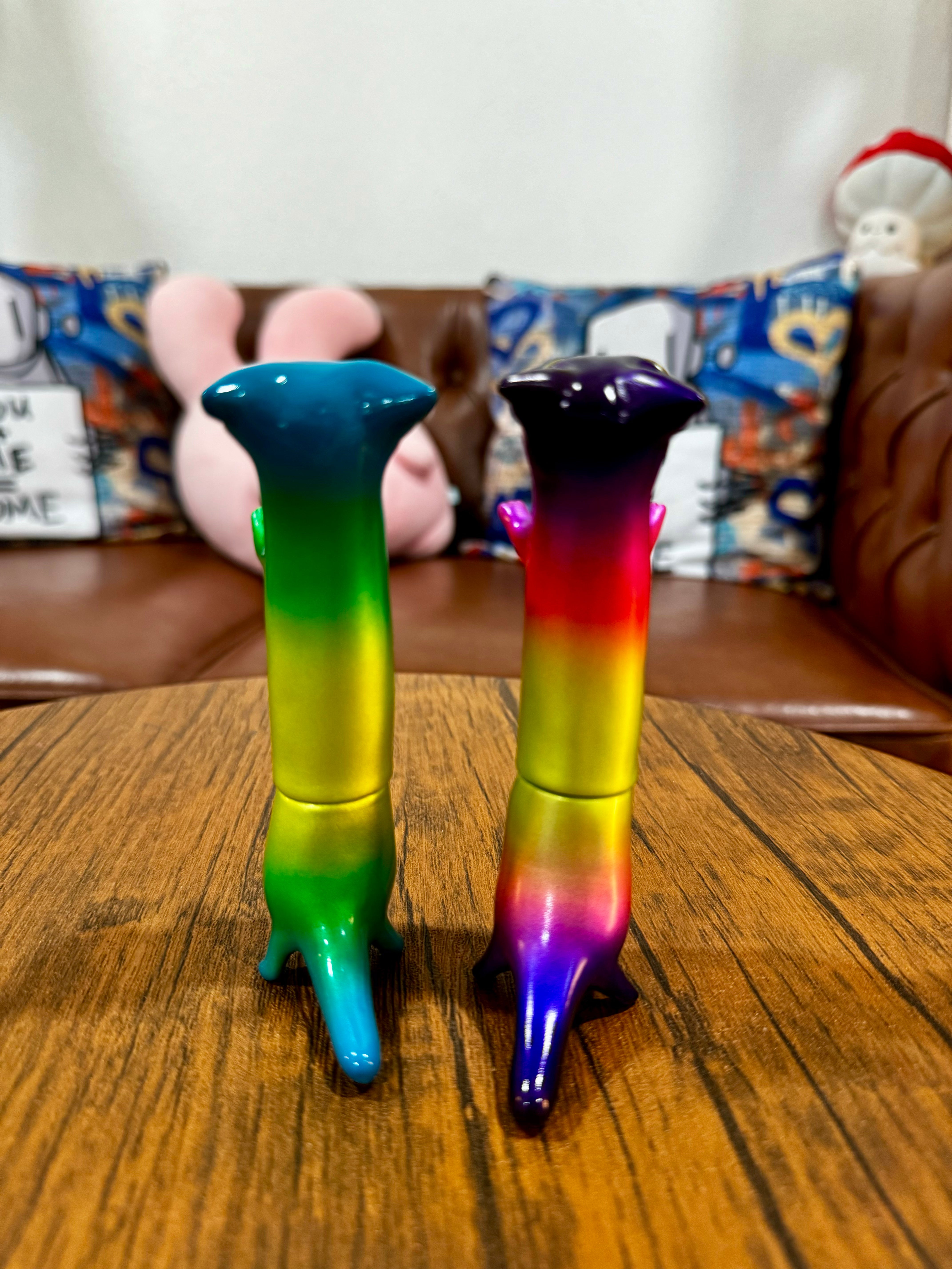 Hebineko Nyaaaga - Metallic Rainbow by Yasu Ebinekoya, 12.7cm Japanese Sofubi figurines, limited to 25 pieces, displayed on a table.