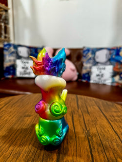 Urukoma - Metallic Rainbow by YASU, a 13cm Japanese Sofubi figurine, limited to 25 pieces, displayed on a table.