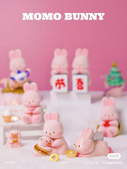 A group of toy rabbits and pigs in a blurry image.