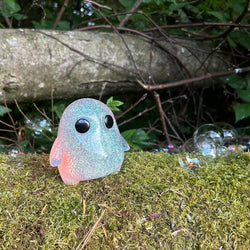 Galaxy Stubby by The Lostlings: a 10cm high-grade resin toy, limited to 50 pieces, displayed on a mossy log.