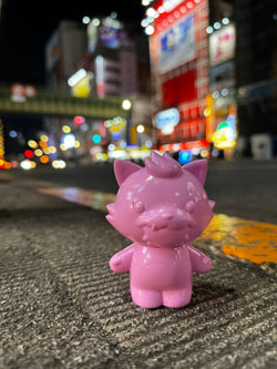 Grandpa Pinku by Prime, a 3 resin toy, limited to 40 pieces, shown outdoors on a grey surface.