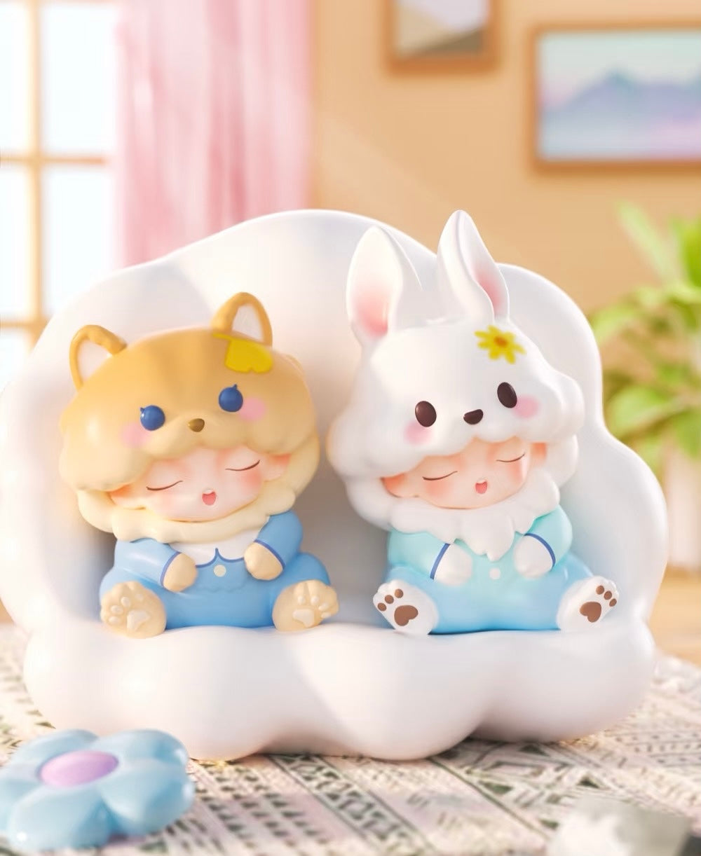 YUMO Stay With You Blind Box Series toy figurines, featuring two baby dolls in a whimsical design, part of a collectible set with regular and secret editions.