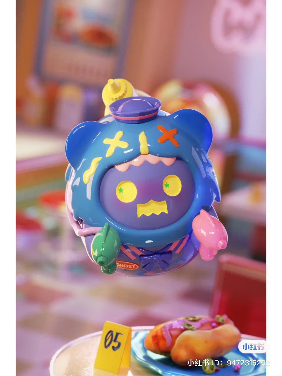 A toy from the ShinWoo Ghost Diner Blind Box Series, featuring various designs including a blue toy with yellow eyes and a hat, a green balloon, and a yellow object with a green star.