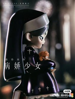 A statue of YANDERE GIRLS - Kristine holding a doll and a baby, with a blurry cross in the background.