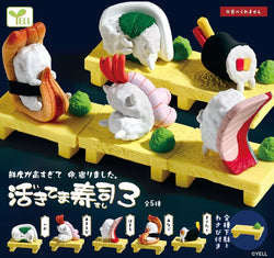 A blind box toy set featuring Live Sushi 3 Gacha Series with sushi figurines, a black belt stuffed animal, and a human body model. Request custom designs on the cart page.