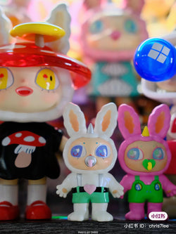 A blind box toy collection featuring Agan Agan-65% bang bang bang, PVC figurines, cartoon characters, and baby toys on a shelf.