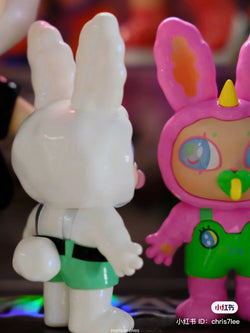 A close-up of Agan Agan-65% bang bang bang, a 8cm PVC toy rabbit figurine from Strangecat Toys, a blind box and art toy store.