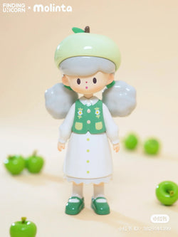 A 8cm PVC figurine of a girl holding a green apple, part of the molinta-65% collection at Strangecat Toys, a blind box and art toy store.