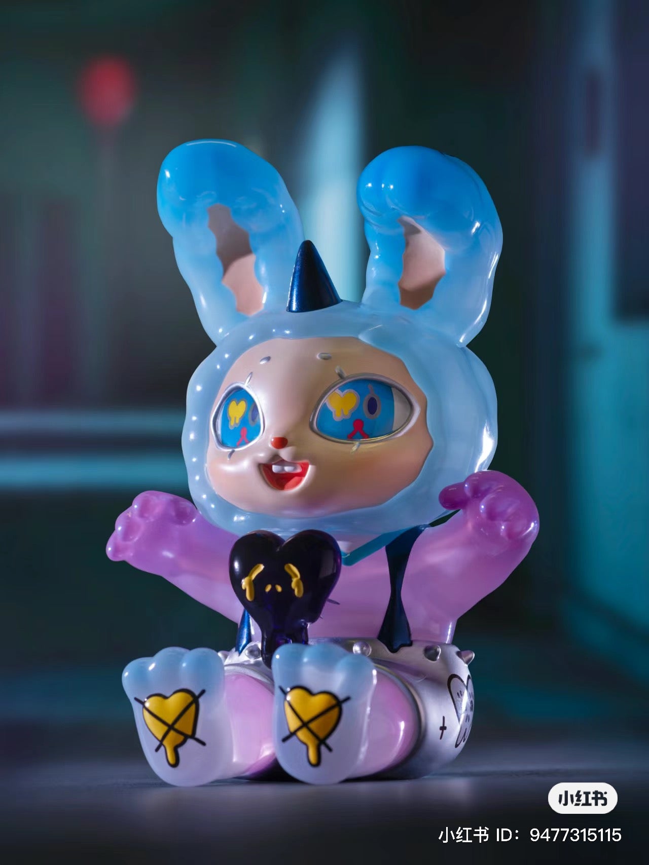 Limited edition PVC toy bunny with blue ears and a hat, 15.6cm tall, by Agan Agan-150%. Found at Strangecat Toys, a blind box and art toy store.