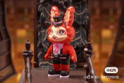 A limited edition PVC figurine, Agan Agan-150% Mr. Top Hat-New Things, 15.6cm. A toy animal on a chair, a red cartoon character with a hat, and a pair of black shoes visible.