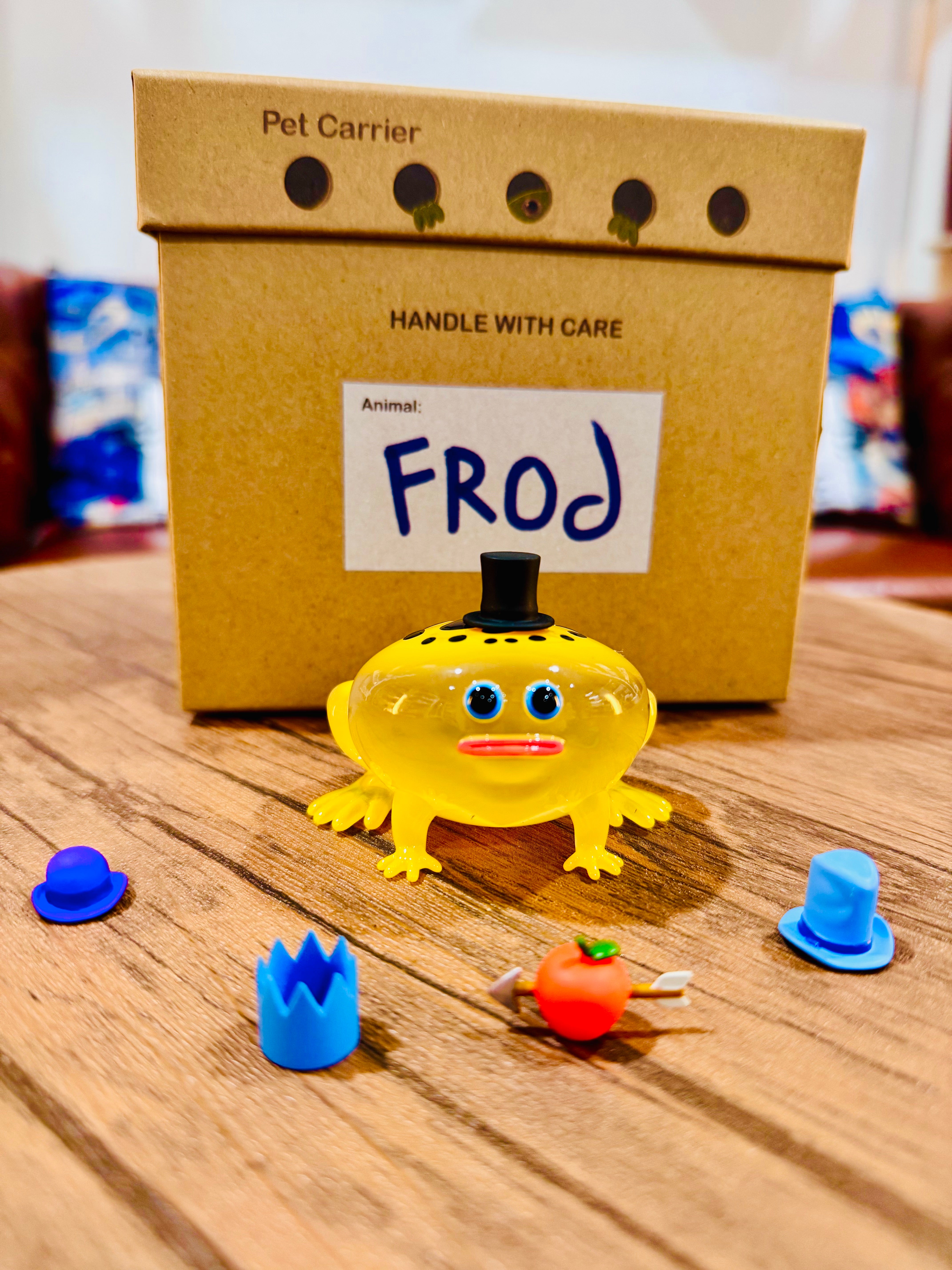 Poison Dart Frod by Sad Salesman: A 9cm resin toy featuring a yellow frog with interchangeable hats, limited edition of 100 pieces.