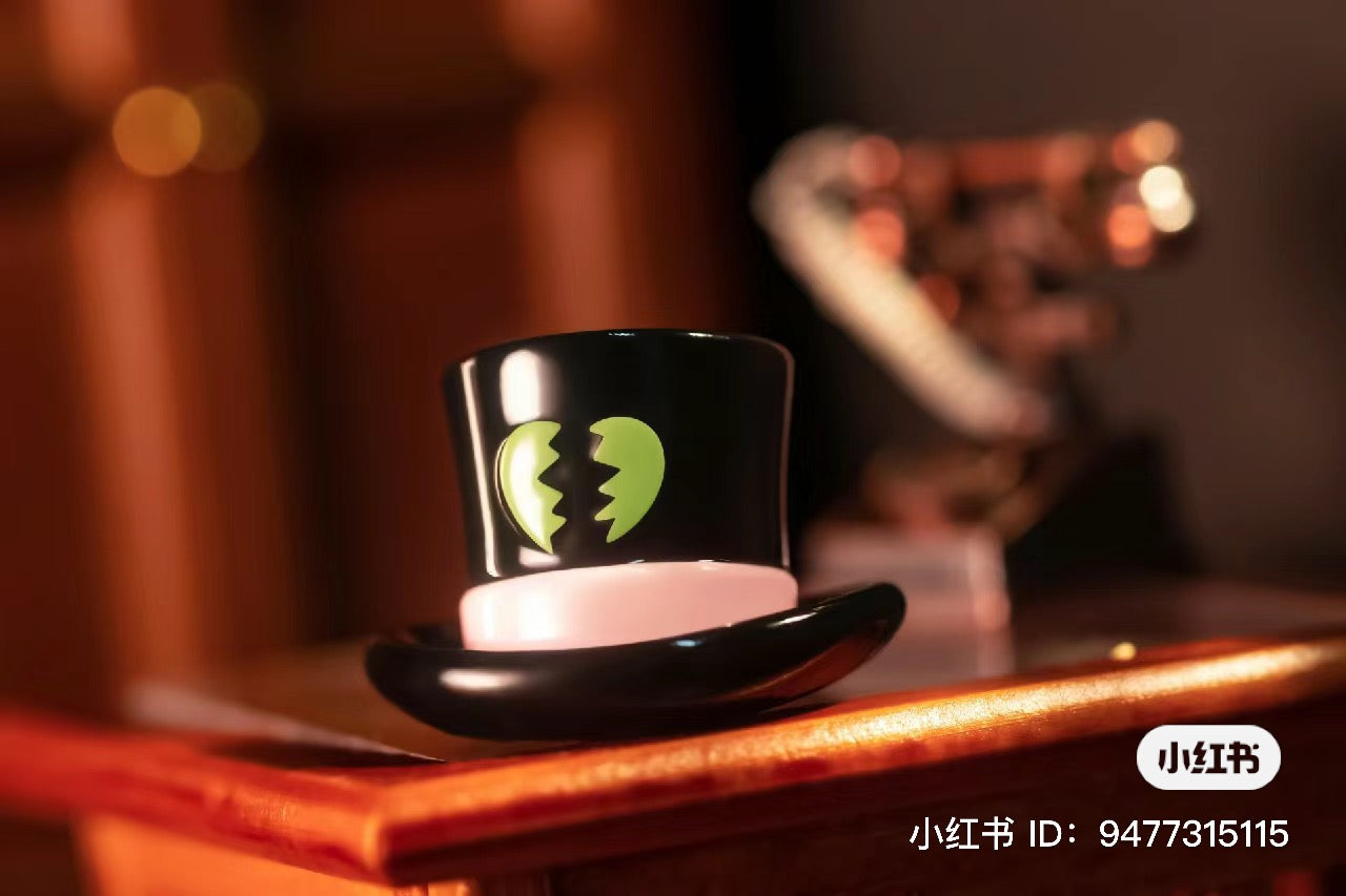 Limited edition PVC Mr. Top Hat figurine, 15.6cm. A small black and white hat with a broken heart design. From Strangecat Toys, a blind box and art toy store.