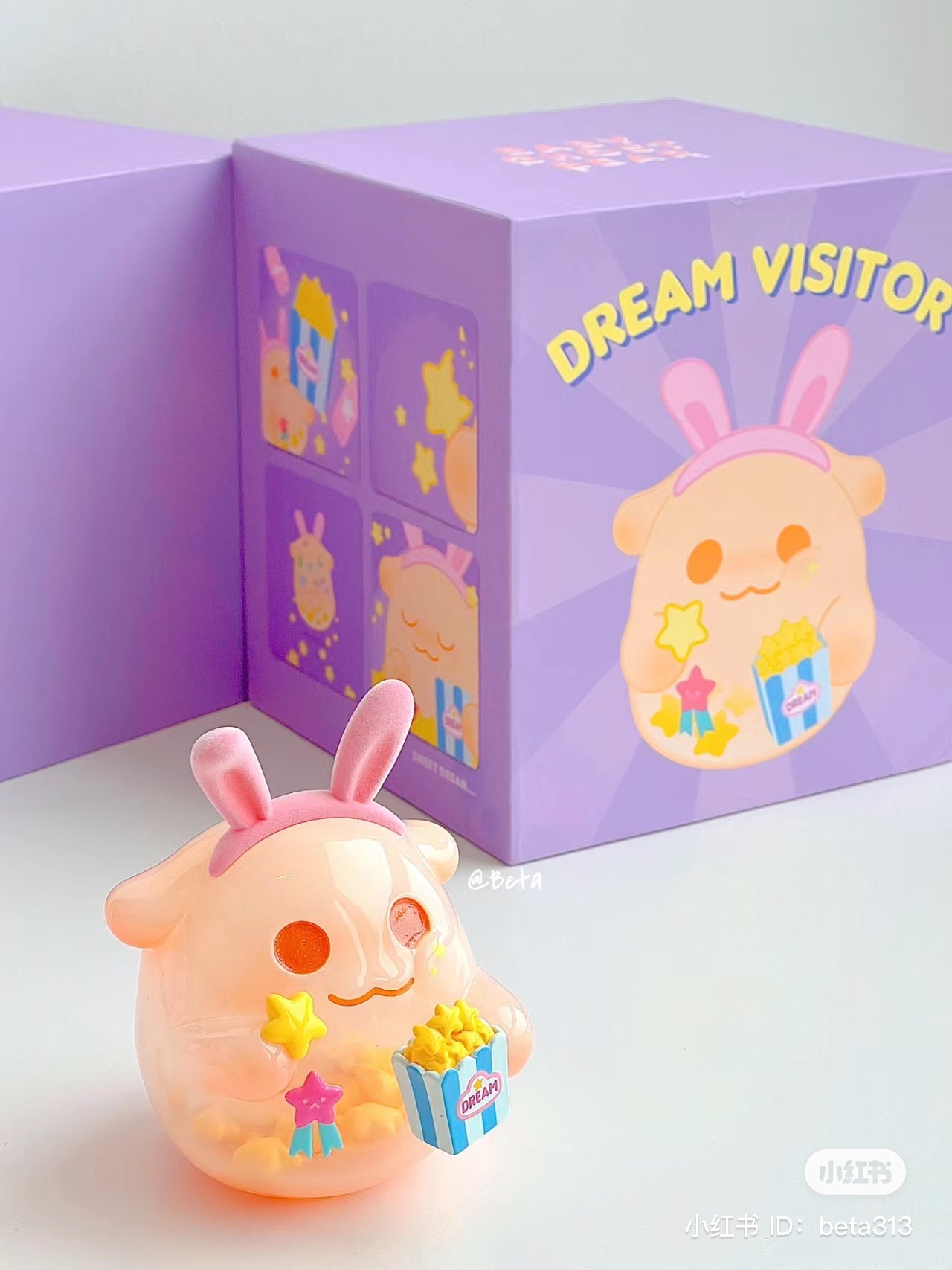 An art toy featuring ShinWoo-150% eat your dreams, a rabbit cartoon character with a popcorn container. Soft vinyl material, 7.3cm size.