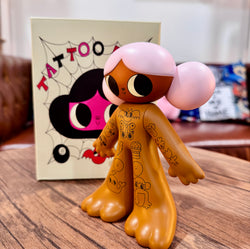 Tattoo Girl - Louise by Burger Babie, a limited edition 5 vinyl toy figurine, displayed on a table with cartoon features.