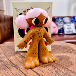 Tattoo Girl - Louise by Burger Babie, a 5-inch limited edition vinyl toy figure with cartoon features, displayed on a table.