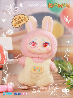 A close-up of KIMMON I'm MIMON Blind Box Series - Preorder toy, featuring a plush rabbit toy in a garment. From Strangecat Toys, a blind box and art toy store.