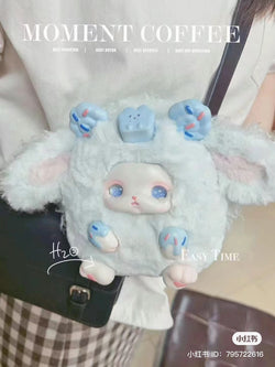 A person holding a Loloan Dessert Blind Box Series plush toy. Preorder - Ships July 2024. Includes 6 regular designs and 1 secret. Purchase a case for 6 regular or 5 and 1 secret.