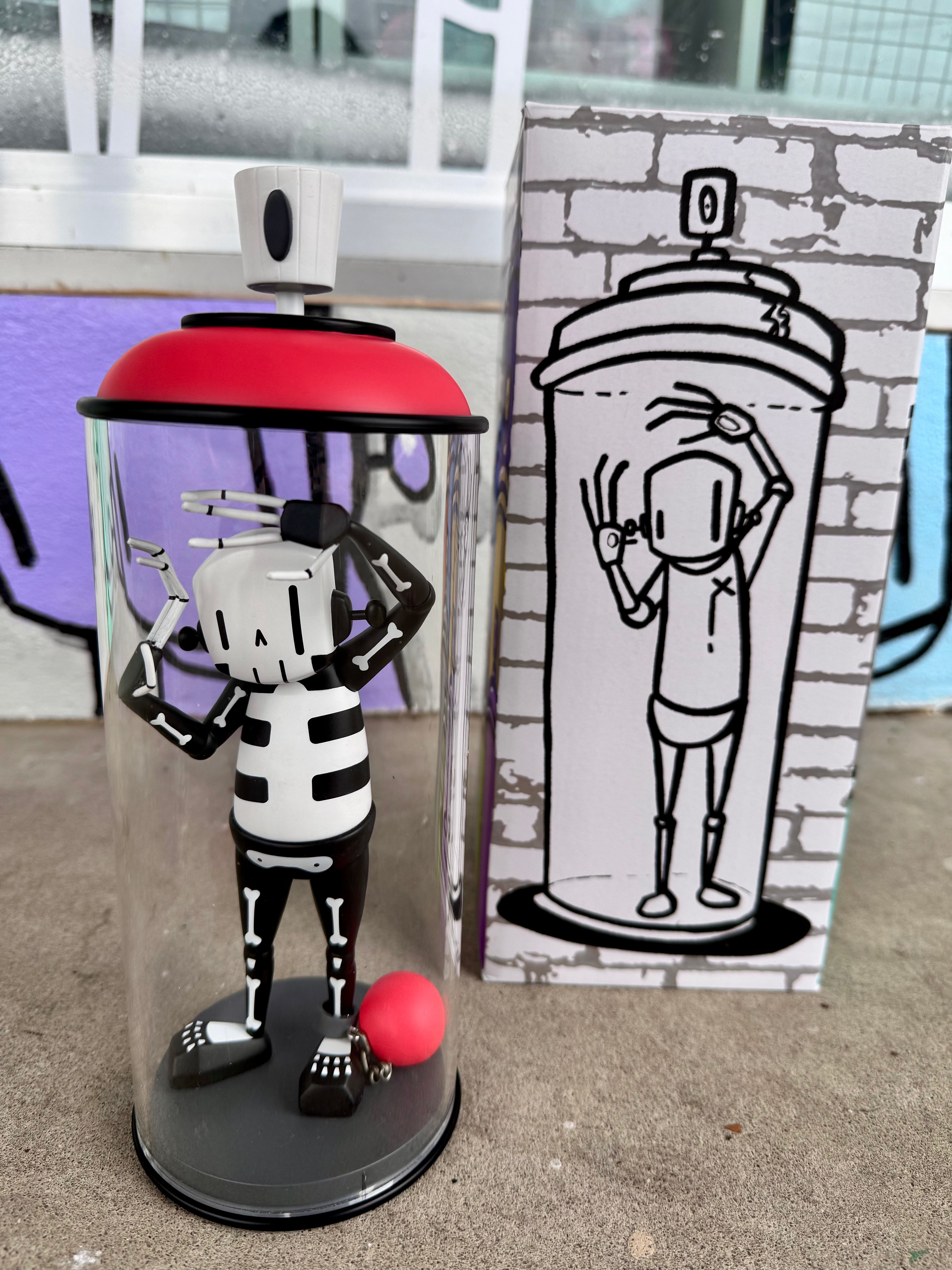 ChrisRWK Contents Under Pressure Vinyl Figure - Bones Edition displayed in a 10 acrylic can, showcasing a black and white skeleton design.