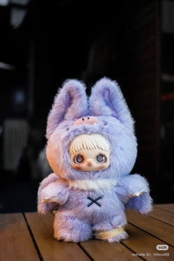 Maymei Dark Forest Plush Blind Box Series toy, a purple stuffed animal with spiral eyes and bunny garment, part of Strangecat Toys' blind box collection.