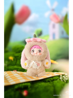 Nommi Garden Rabbit Plush from Blind Box Series, featuring a stuffed toy in bunny attire, part of a collectible set.