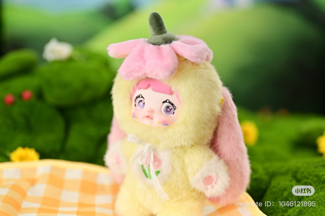 Nommi Garden Rabbit Plush Blind Box Series, a close-up of a stuffed toy with a cute face, part of a collectible series.