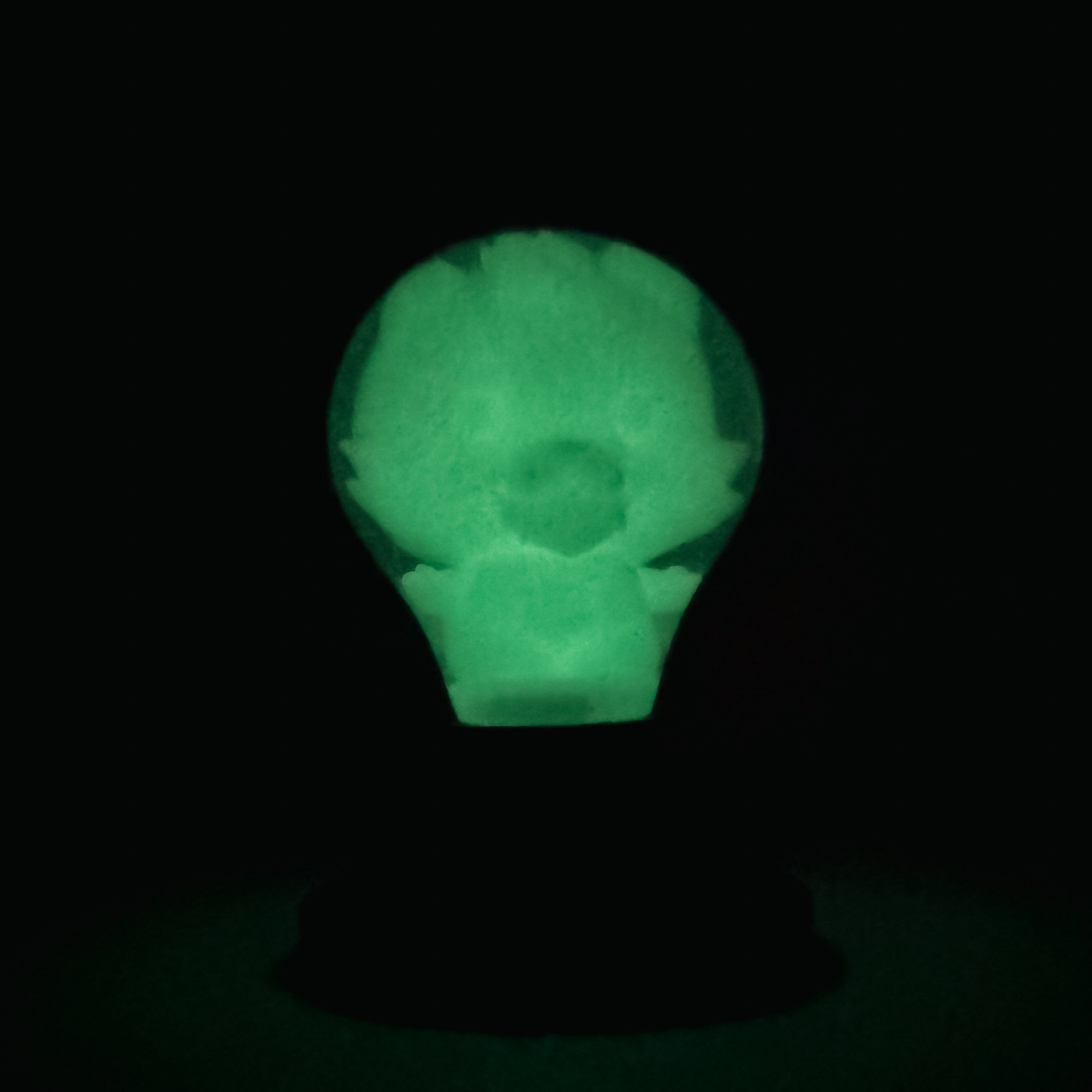 Hello World - GRANDPA GID BLB by JFO: A unique green light bulb design featuring a small figure inside, micro batteries included, exclusive to Strangecat Toys.