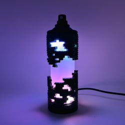 Hello World - BRIX NEBULA CAN by JFO, a lit lamp with a wire, showcasing intricate design, available with a power cable.