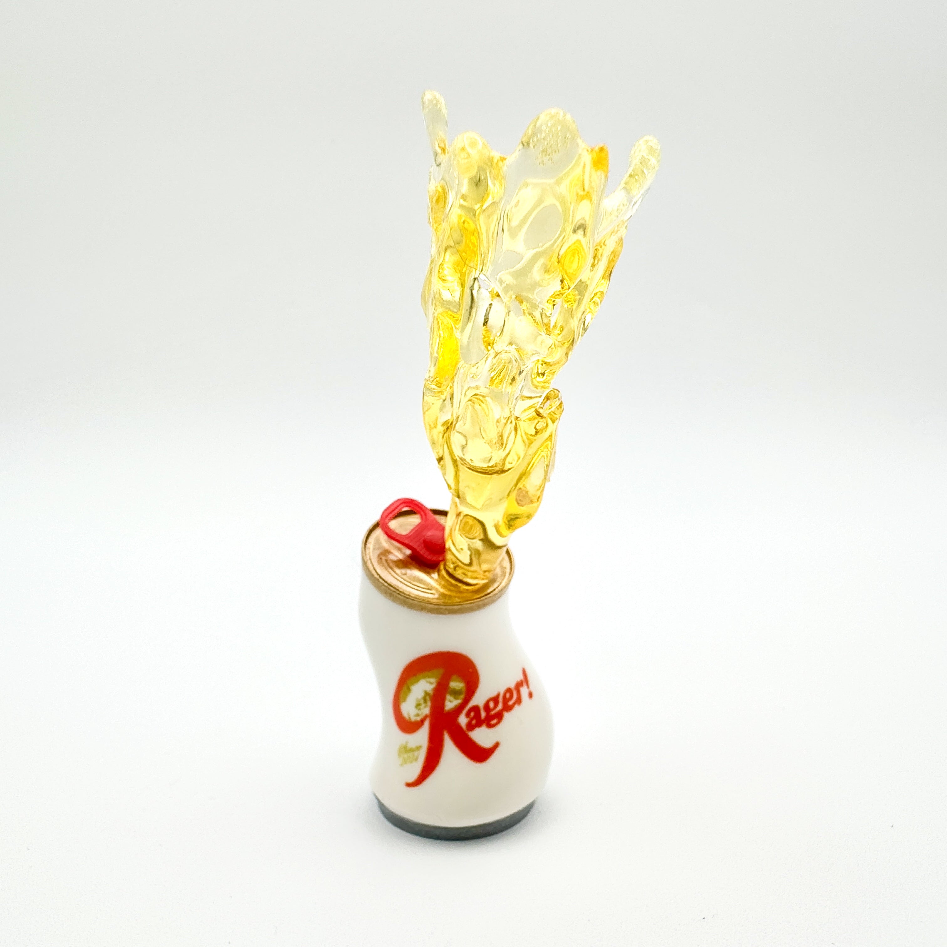 Hello World - RAGER! by JFO, a small resin art toy can with yellow liquid splash effect, featuring a red logo and pull tab.