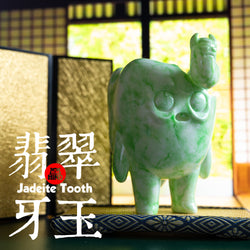 Jadeite Tooth sculpture by Bear In Mind Toys, a limited soft vinyl piece of an animal figure statue with text and a logo.