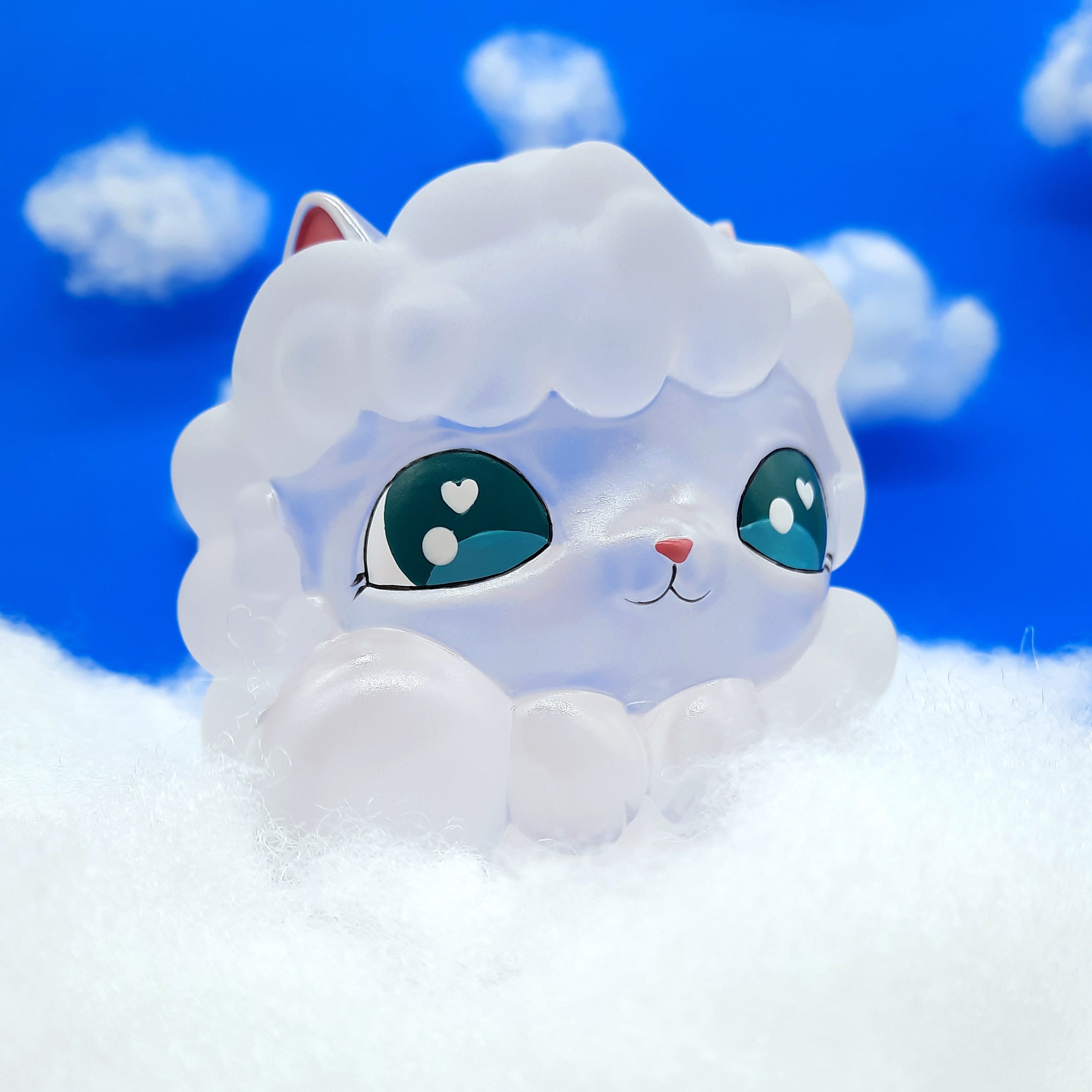 Alt text: Kumo Kitty resin toy on snow, 4 inches tall and wide, limited to 50 pieces.