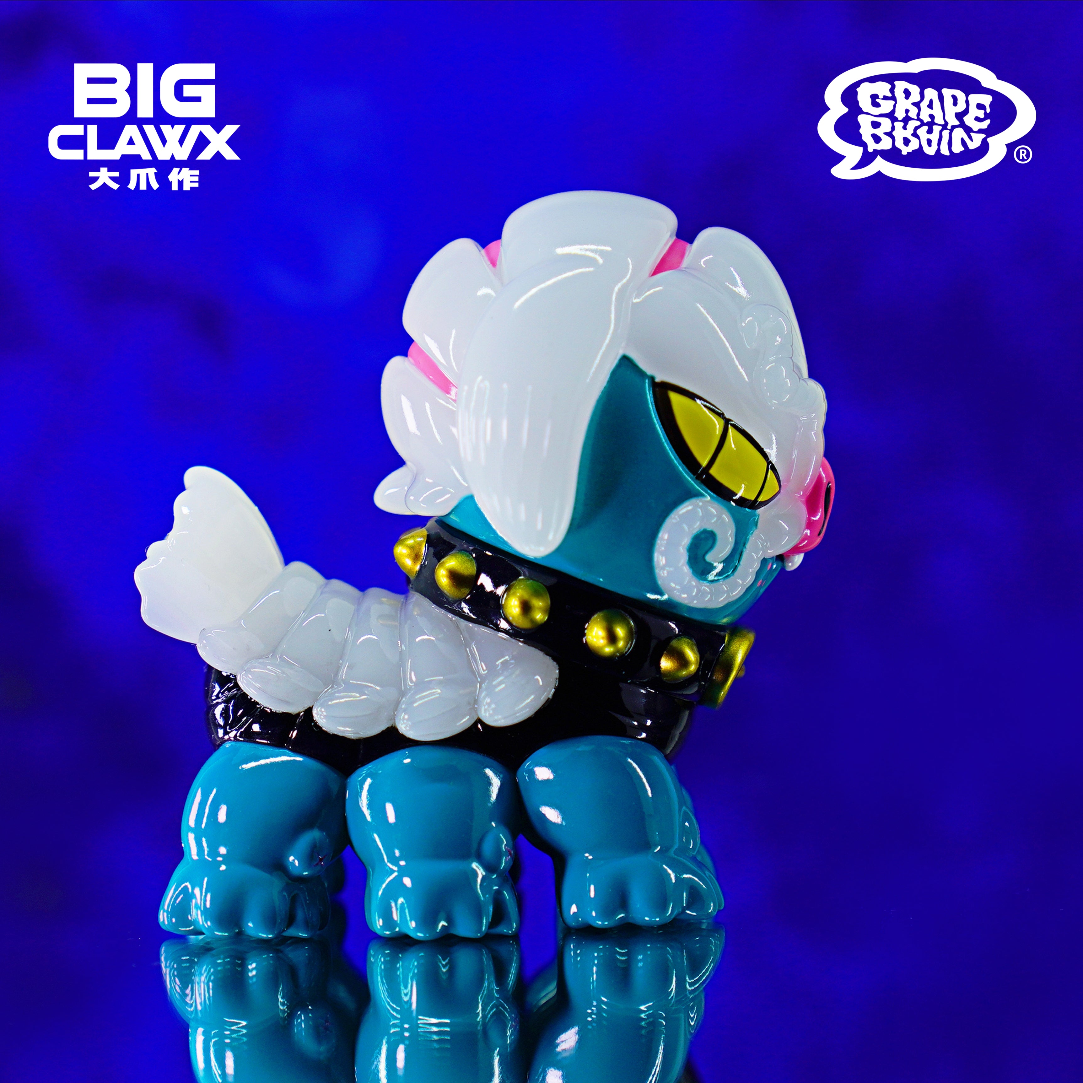 A close-up of a toy from Cola - GID Blue by BigClaw x Grape Brain, 9cm Soft Vinyl.