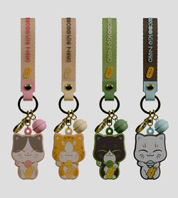 Manecookie Neko Keychain Blind Box featuring cartoon cat charms, includes keyring, bag clip, strap, and bell. Silicone material, designed by FigCat.